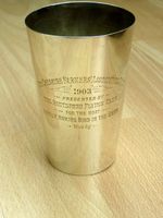 An antique solid silver presentation beaker for pigeon racing / flying 1903