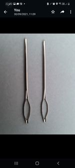 A  pair sister locs/ locks retightening hair tool needle