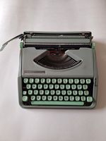Vintage Hermes Baby typewriter with case