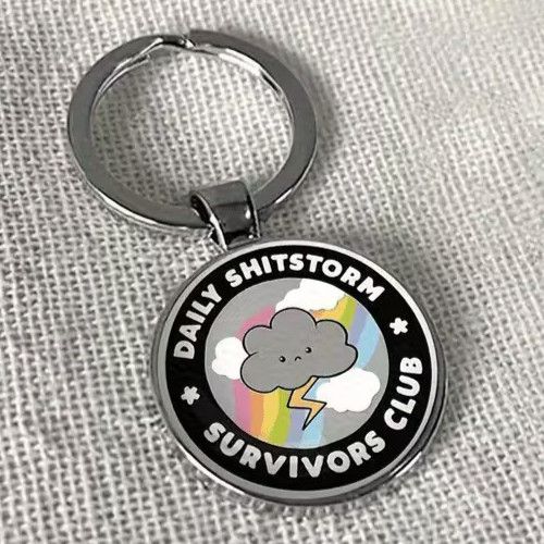 Daily Shitstorm Survivors Club Round Silver Metal Keyring Bag Charm Funny Gift — image 1