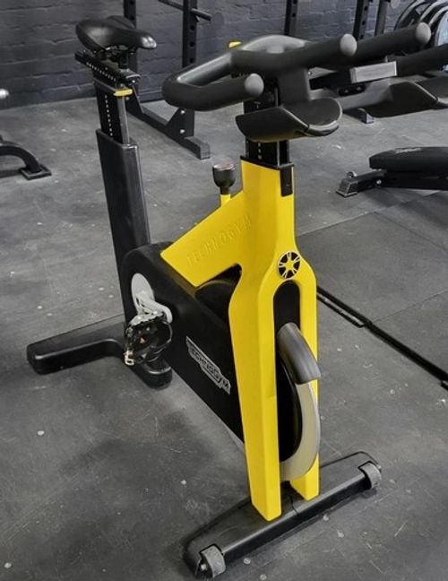 Technogym Aerobic Training Cycle Exercise Bike Yellow & Black Adjustable Seat
