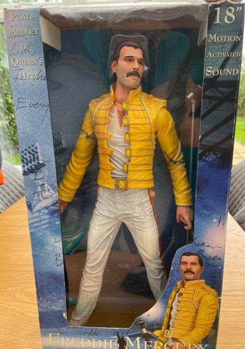 Freddie Mercury 18inch box slightly Damaged figurine in good working condition.