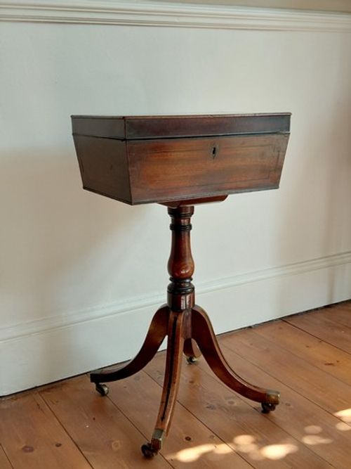 Antique Regency Teapoy Table in mahogany with brass castors and ebonised inlay