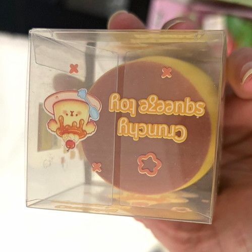 Crunchy Tactile Squeeze Toy Yellow Brown Squishy in Clear Box Packaging