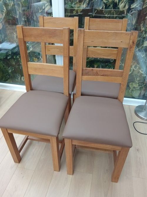 4 Solid Oak Dining Chairs in good condition with New seat pads.Free local del.
