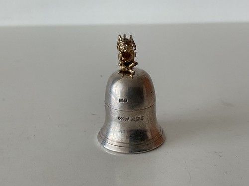 Sterling silver first tooth pot with a gilded fairy on top. 1992. Harman bros.