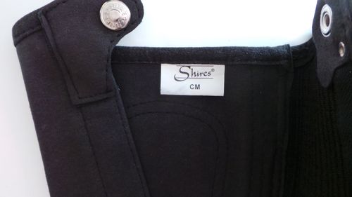 OPENED BUT UNUSED SHIRES SYNTHETIC HALF CHAPS BLACK MEDIUM — image 4