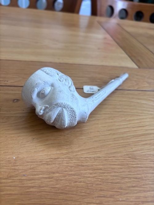 hand carved clay pipe