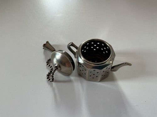 Antique tea strainer/diffuser.  Design no.883376, made in England